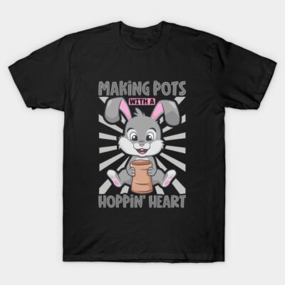 Black t-shirt with playful bunny graphic, "Making Pots with a Hoppin' Heart" text, perfect for pottery enthusiasts.