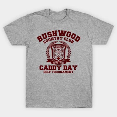 Gray cotton t-shirt with "Bushwood Country Club Caddy Day Golf Tournament" graphic in red text. Casual sportswear.
