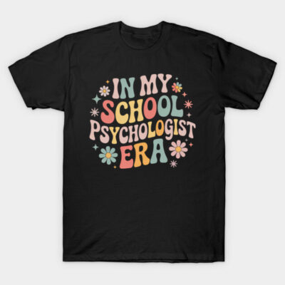 Black T-shirt with colorful retro text "In My School Psychologist Era" and floral design, casual cotton wear.
