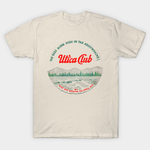 Vintage-style cream t-shirt featuring Utica Club graphic with mountains and forest design, perfect for casual wear.