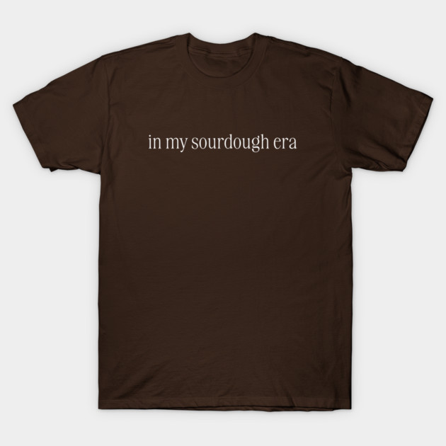 Brown cotton t-shirt with "in my sourdough era" text, casual style, perfect for everyday wear.