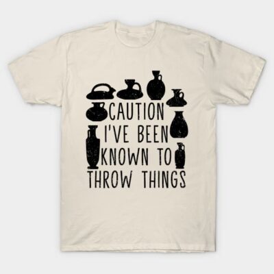 Cream T-shirt with black pottery graphic and humorous text, casual style, cotton material, perfect for everyday wear.