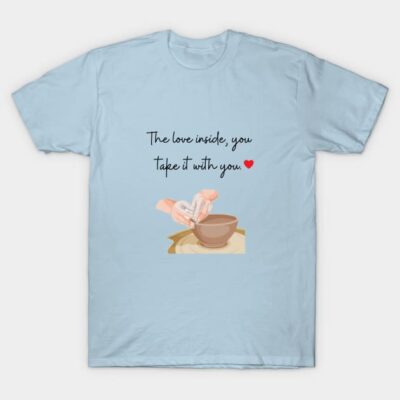 Light blue graphic t-shirt with "The love inside, you take it with you" quote and heart design, casual cotton material.