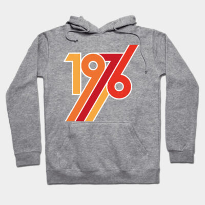 Gray hoodie with retro "1976" design in red, yellow, and orange. Casual cotton blend, ideal for everyday wear.