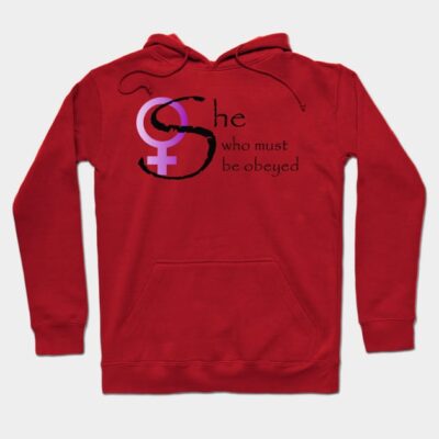 Red hoodie with "She who must be obeyed" text, purple and black design. Comfortable casual wear, cotton material.