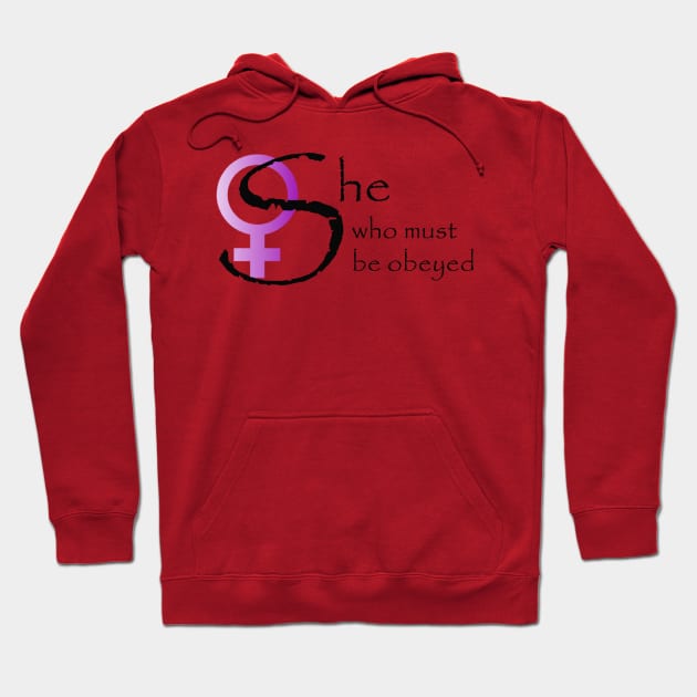 Red hoodie with "She who must be obeyed" text, purple and black design. Comfortable casual wear, cotton material.