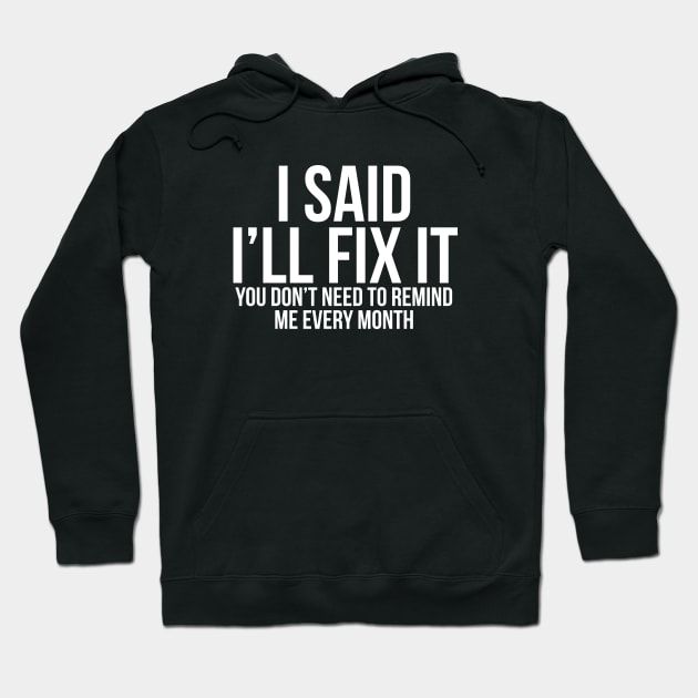 Black hoodie with humorous "I Said I'll Fix It" text, casual style, cotton blend, perfect for everyday wear.