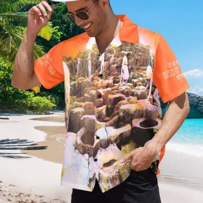 Orange short-sleeve Hawaiian shirt with rock formation print, casual beachwear style, lightweight fabric.