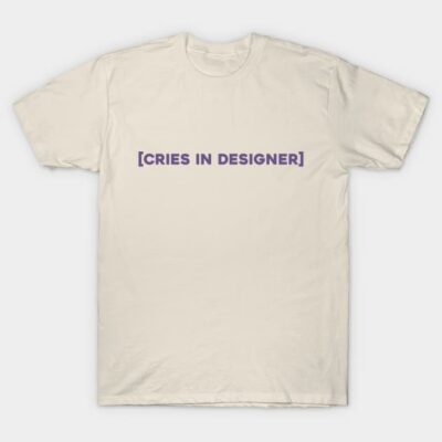 Cream t-shirt with purple "Cries in Designer" text, casual style, made of soft cotton, perfect for everyday wear.
