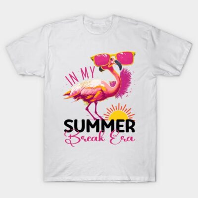 White t-shirt with colorful flamingo print, sunglasses, and "Summer Break Era" text, perfect for casual summer wear.