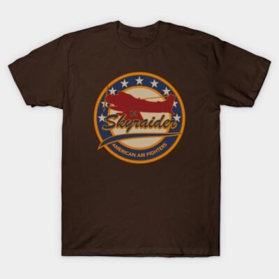 Brown graphic t-shirt featuring vintage airplane design with "Skyraider" text, ideal for aviation enthusiasts.
