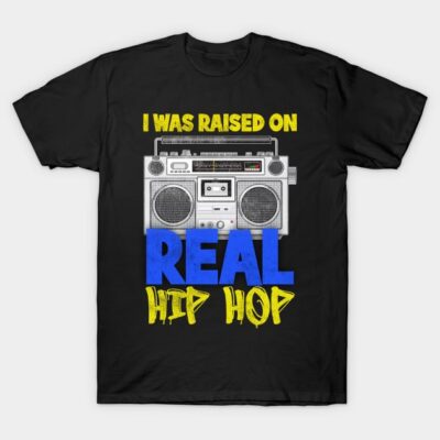 Black t-shirt with retro boombox graphic and "I Was Raised on Real Hip Hop" text in yellow and blue.