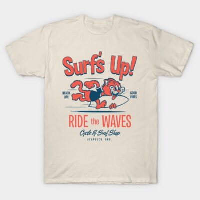 Cream surf-themed t-shirt with "Surf's Up!" graphic, featuring cartoon cat and surfboard, casual beachwear style.