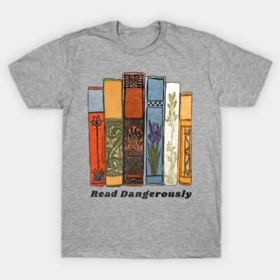 Gray T-shirt with colorful book spine design, "Read Dangerously" text, casual style, cotton material.