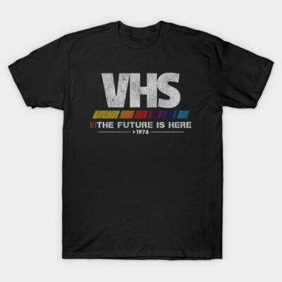 Black T-shirt with "VHS The Future Is Here 1976" text, retro style, short sleeve, cotton fabric, casual wear.