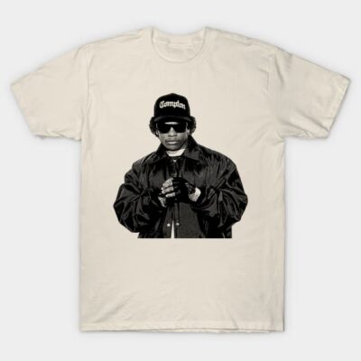 Cream graphic t-shirt featuring a black-and-white illustration of a person in sunglasses and a cap. Casual streetwear.