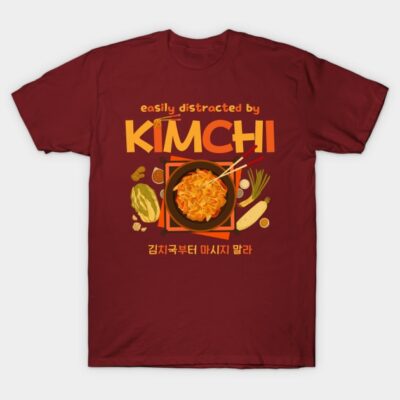 Red T-shirt with "Easily Distracted by Kimchi" slogan, featuring kimchi bowl graphic, ideal for casual wear.