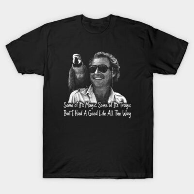 Black graphic t-shirt with retro-style print, featuring a parrot and figure, text reads "Some of It's Magic, Some Tragic."