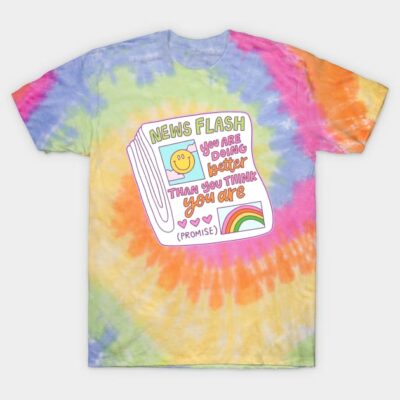 Tie-dye t-shirt with motivational newspaper graphic, colorful rainbow pattern, casual unisex style, cotton fabric.