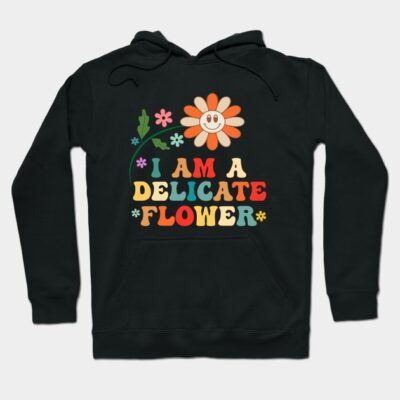 Black hoodie with colorful text "I Am A Delicate Flower" and smiling flower graphic. Casual, comfortable design.