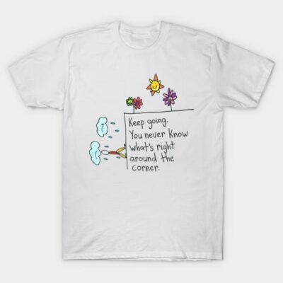 White motivational t-shirt with colorful cartoon design and inspirational text, perfect for casual wear.