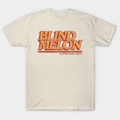 Cream graphic T-shirt with bold orange "Blind Melon" text, alternative rock style, cotton material.