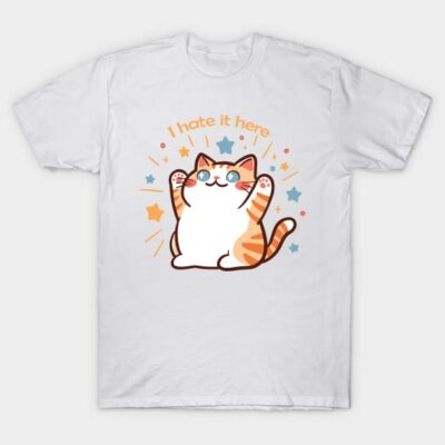 White T-shirt with cute cat graphic, "I hate it here" text, colorful stars, casual style, cotton fabric.
