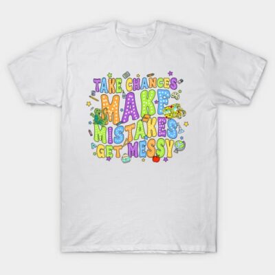 White T-shirt with colorful "Take Chances, Make Mistakes, Get Messy" graphic design, casual wear, cotton fabric.