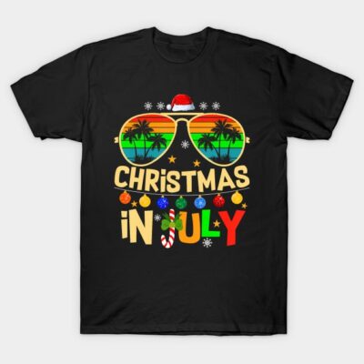 Black t-shirt with "Christmas in July" design, featuring tropical sunglasses and festive text, perfect for summer holidays.