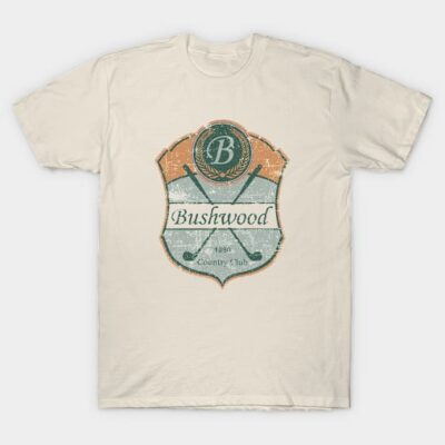 Cream t-shirt with vintage "Bushwood Country Club" graphic, featuring crossed golf clubs and retro badge style.