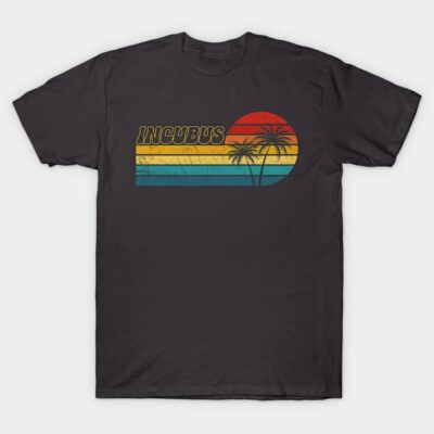 Black graphic tee with retro sunset and palm tree design, featuring bold text. Casual style, perfect for everyday wear.