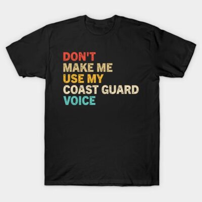 Black T-shirt with bold multicolored text, "Don't Make Me Use My Coast Guard Voice," casual wear statement piece.