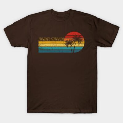Brown vintage graphic t-shirt with retro sunset and palm trees design, perfect for casual wear and summer style.