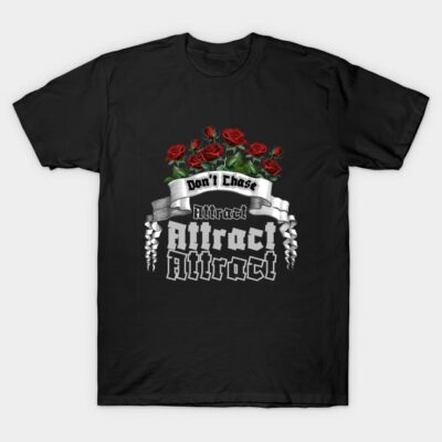 Black t-shirt with "Don't Chase, Attract" slogan, featuring red roses and gothic font design. Casual wear.