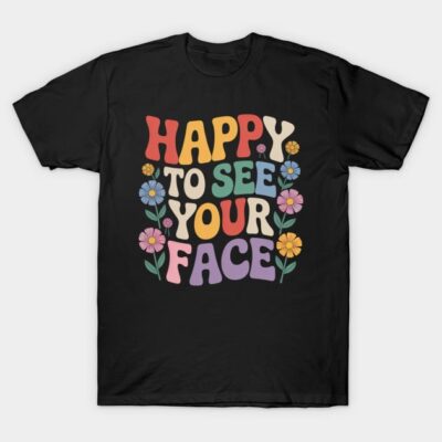 Black graphic T-shirt with colorful "Happy to See Your Face" text and floral design, casual cotton style.