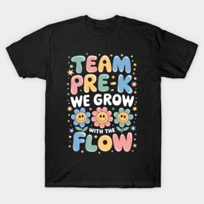 Black t-shirt with colorful "Team Pre-K We Grow With the Flow" text and smiling flowers, fun preschool design.