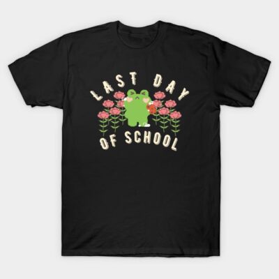 Black t-shirt with "Last Day of School" text, featuring a cute green frog and pink flowers, perfect for casual wear.