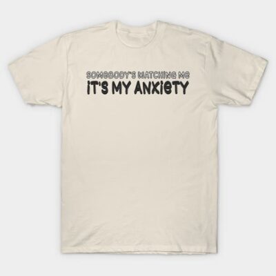 Beige cotton t-shirt with "Somebody's Watching Me, It's My Anxiety" text, casual style, unisex design.