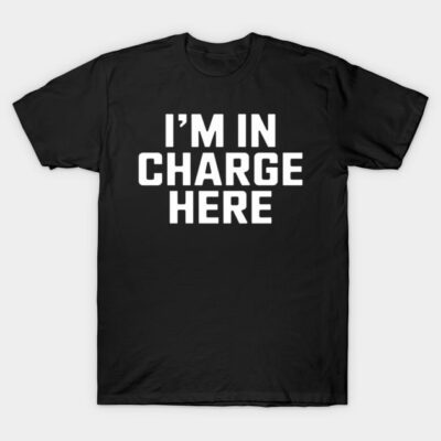 Black cotton t-shirt with bold white text "I'm In Charge Here," casual style, perfect for everyday wear.