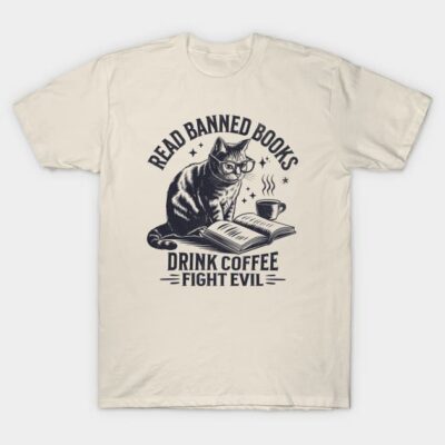 Cream t-shirt with cat reading print, "Read Banned Books, Drink Coffee, Fight Evil," casual unisex cotton top.