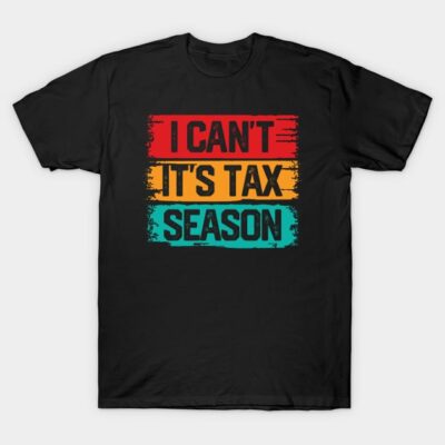 Black t-shirt with colorful "I Can't It's Tax Season" text design, casual style, unisex, cotton blend material.