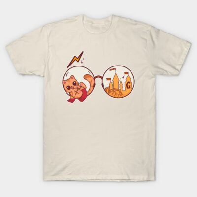 Cream t-shirt with whimsical cat and castle graphic, perfect for casual wear. Soft cotton material, unisex design.