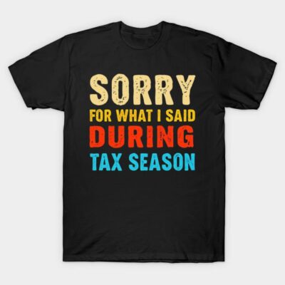 Black T-shirt with colorful "Sorry for What I Said During Tax Season" text, casual style, cotton material.