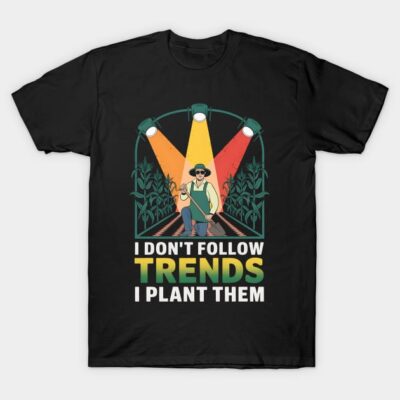 Black cotton t-shirt with colorful gardening graphic and "I Don't Follow Trends, I Plant Them" text, casual style.