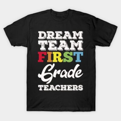 Black t-shirt with "Dream Team First Grade Teachers" multicolored text, perfect for educators. Cotton material.
