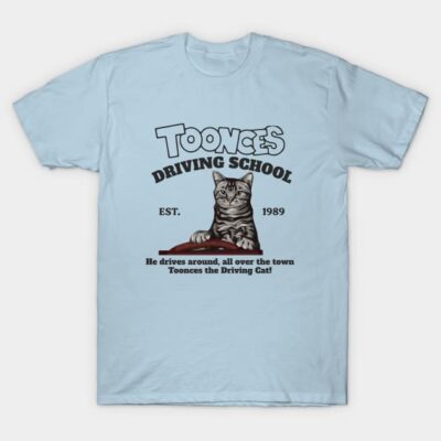 Light blue graphic t-shirt with "Toonces Driving School" and cat illustration, casual wear, cotton material.