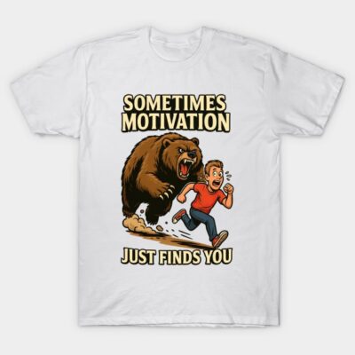 White t-shirt with cartoon bear and runner graphic, "Sometimes Motivation Just Finds You" text, casual wear.