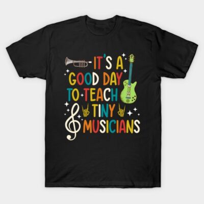 Black t-shirt with colorful "It's a Good Day to Teach Tiny Musicians" text and musical instrument graphics.