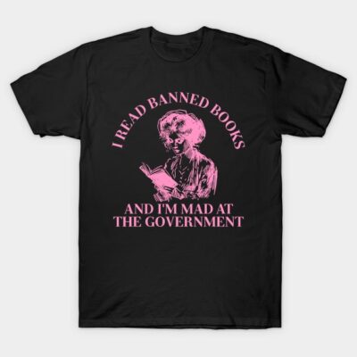 Black t-shirt with pink text and graphic, featuring "I Read Banned Books" slogan, casual and bold statement apparel.