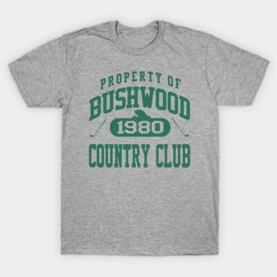 Gray t-shirt with "Property of Bushwood Country Club 1980" green text, casual style, cotton material.